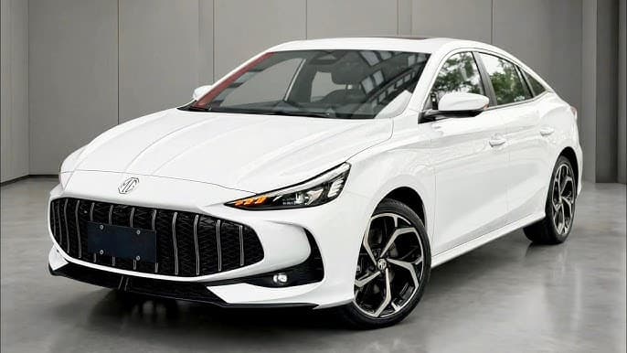 Sporty yellow MG GT 2026 fastback sedan driving on a scenic curve